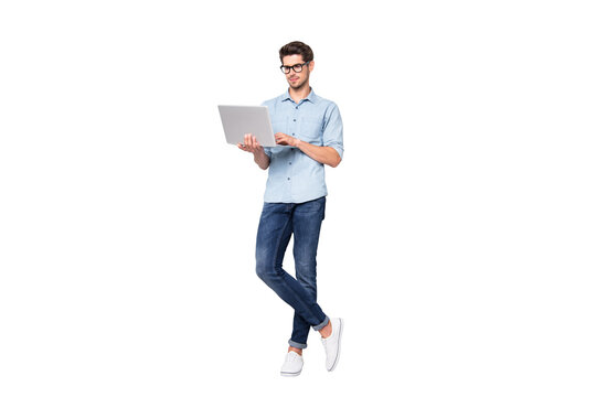 Full length body size photo of focused serious intelligent coworking manager standing confidently with legs crossed searching for news via internet connection isolated grey color background