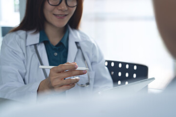 Female doctor and patient in appointment at doctor office with advice. Medical clinic, male patient and medical professional at desk with support, healthcare at checkup, close up