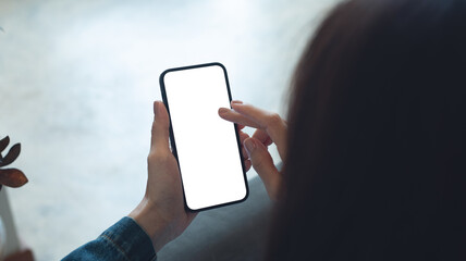Mockup, blank screen cell phone. Woman using mobile phone, finger touchoing on blank white screen at home. Template for web design, mobile app, online marketing on technology device, closeup