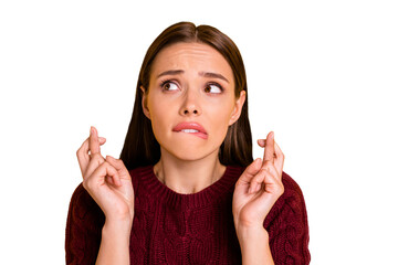 Close up photo cute terrified attractive girl with her fingers crossed biting lips in wait of...