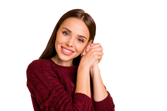 Photo of nicely looking kind cute girl having laid her head onto her hands staring into camera while isolated with yellow background