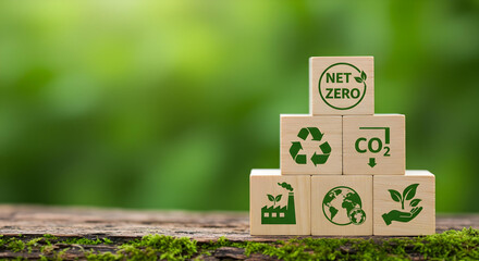 Environmental icons on wooden blocks, promoting eco-friendly action for nature
