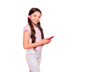 Portrait  of lovely child holding modern technology smiling wear white t-shirt pants trousers isolated over pink background