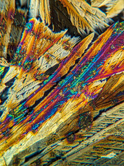 Radial crystal structures under polarized microscope with colorful edge