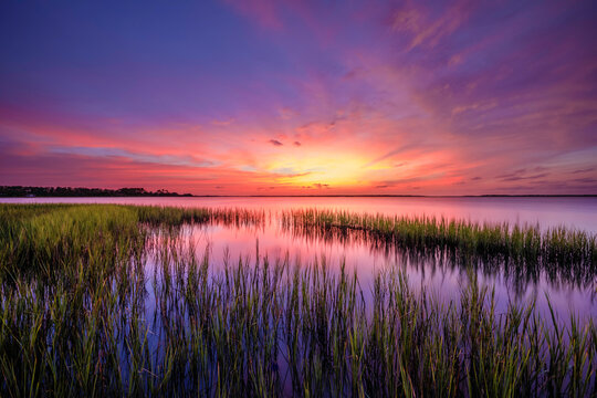Colorful clouds before sunrise in the marsh in Beaufort, NC