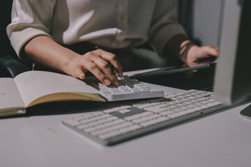 Expert woman asian female people review data number costing managerial account prepare monthly actual cost variance report at tax audit office. ESG sheet budget control ERP process service project.