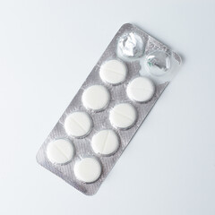 Silver blister pack with medical tablets for treatment and healthcare, isolated on white