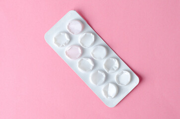 Empty tablet blister pack on plain background, isolated for pharmaceutical and medical concepts