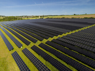 Aerial View of Large Solar Farm on Rolling Hills Near Bitburg, Germany