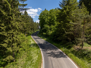 Winding Roads Through the Forested Hills of the Eifel, Germany – Aerial Shot
