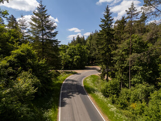 Winding Roads Through the Forested Hills of the Eifel, Germany – Aerial Shot