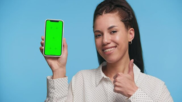 Happy customer showing green screen phone with thumbs up