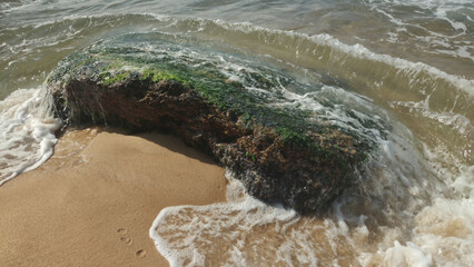 Urca neighborhood city Sugarloaf travel vacation life beautiful nature sky sea ocean beach foam splash water horizon landscape mountains stone rock detail close algae clean