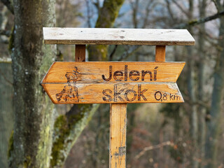 Signpost with Slovenian inscription "jeleni skok" or forest sign "deer's jump"