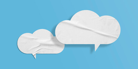White speech bubble crumpled paper isolated on light blue background