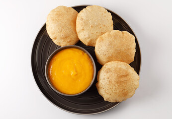 Indian Food - Aamras is a sweet dish made from the pulp of the Alphonso mango fruit. Served with hot puri/poori. Sweet Mango puree garnished with Kashmiri Saffron. Aam Ras Puri OR Alphonso Mango