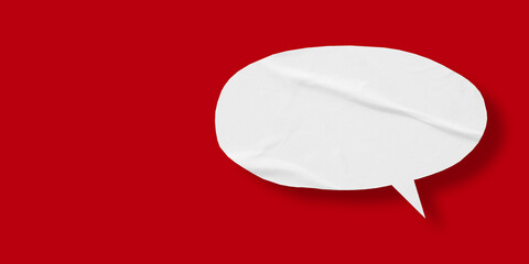 White speech bubble crumpled paper isolated on red background