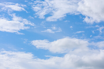 Beautiful cloud formations gather across a vivid blue sky, creating a stunning and peaceful natural backdrop.