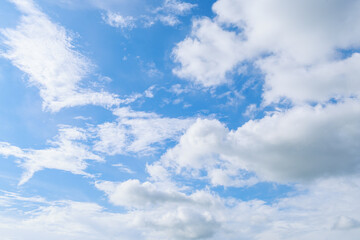 Beautiful cloud formations gather across a vivid blue sky, creating a stunning and peaceful natural backdrop.