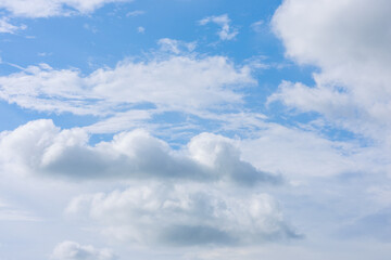 Beautiful cloud formations gather across a vivid blue sky, creating a stunning and peaceful natural backdrop.