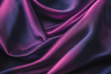 Obraz premium Dark blue purple pink silk satin. Abstract elegant background for design. Color gradient. Silky smooth fabric. 