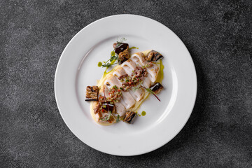 Nestled in an elegant setting, beautifully plated gourmet dishes and artisanal beverages delight the senses during a bustling dinner service, inviting culinary exploration