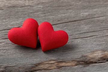 Two Red Felt Hearts on Rustic Wood: A Romantic Image