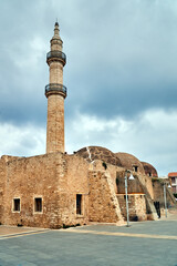 stone, historic minaret of the Turkish mosque in the city of Rethymnon on the island of Crete