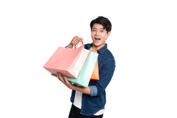 Portrait of young Asian man holding shopping bag posing on PNG background