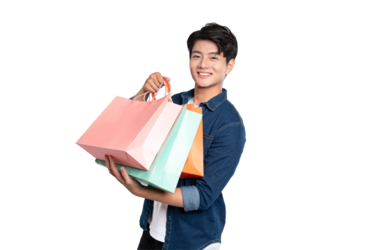Portrait of young Asian man holding shopping bag posing on PNG background