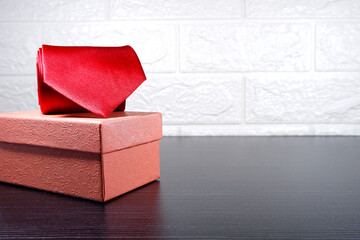 A necktie rolled on gift box closeup view , gift concept 