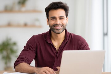 Fototapeta premium Smiling Man with Laptop: A Portrait of Modern Professionalism