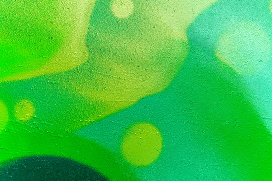 Fototapeta bright colorful pattern of beautiful street wall with art graffiti background. Vivid modern urban texture for wallpaper and design