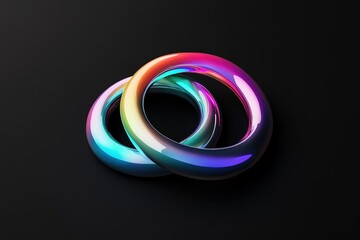 Two interlocked metallic tori display bright iridescent colors against a black backdrop, creating interest