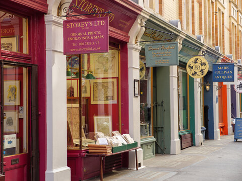 Westminster, London, UK - April 25, 2025: Small independent arts and antiques shops in Cecil Court, West End