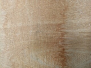 Aged Plywood Texture. Close-up of weathered plywood with visible grain and natural imperfections, perfect for rustic or industrial backgrounds