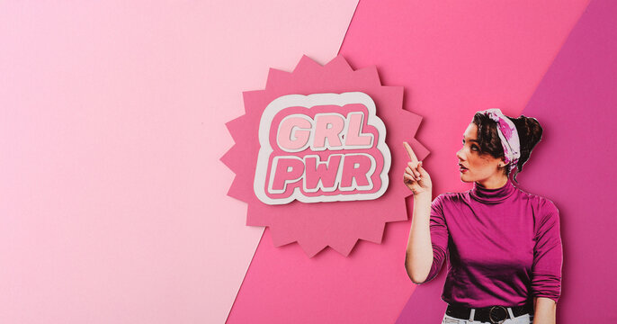 Young pin-up woman with GRL PWR sign showing muscles on yellow background. Women's History Month