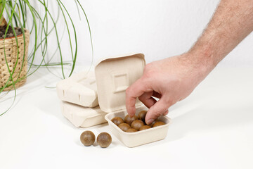 man takes capsules for coffee machine