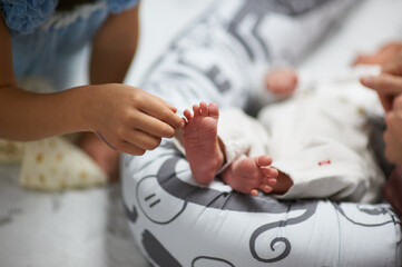 relatives want to pet the baby at home, affection in the family for a newborn boy