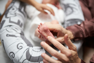 relatives want to pet the baby at home, affection in the family for a newborn boy