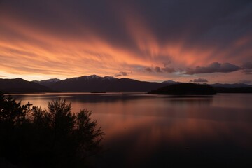 A view of a large body of water with a mountain range in the background.