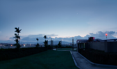 Evening Urban Landscape with Waterfront Views and Serene Sky..