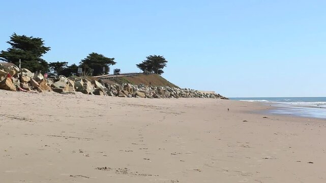 Pacific coast state beach just north of Ventura, California. A recreational vehicle RV motorhome passes by on the PCH Highway 1, Pacific Coast Highway.
