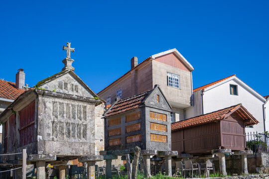 Iconic horreos and traditional architecture in Combarro, a charming Galician village in Pontevedra, Spain. The site dates back to the 12th century and is a symbol of cultural heritage.