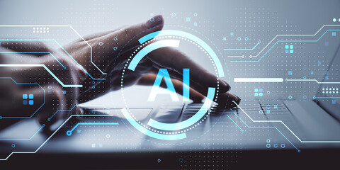 Closeup of hands typing on laptop keyboard with artificial intelligence interface overlay and futuristic digital tech elements on blurred background.