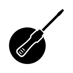 Silhouette of a flathead screwdriver tool on a round black surface