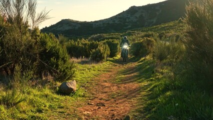 Enduro Motorcycle Rider Driving in High Mountain Landscape, Madeira Island , Portugal