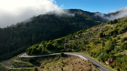 Fototapeta premium Motorcycle Rider Driving in High Mountain Landscape, Madeira Island , Portugal