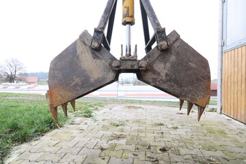 A large piece of equipment with a claw on the front