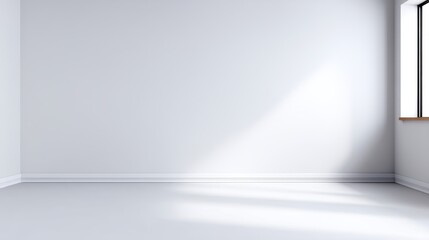 Bright, empty room with white walls and a window casting natural light on the floor